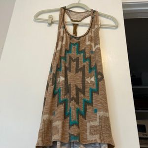 Medium tan , turquoise, brown tunic , twisted bronze beads in the back.